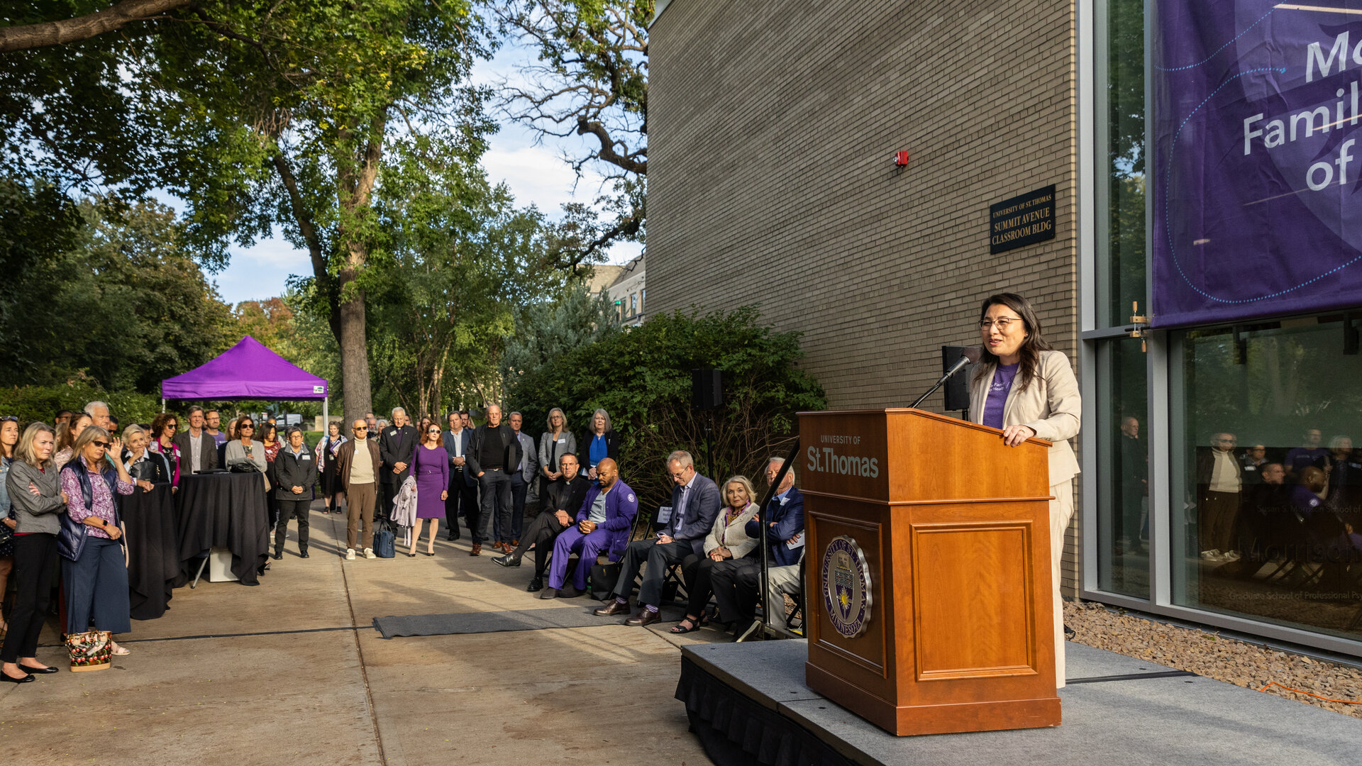 Dean MayKao Hang delivers a speech outside the Summit Classroom Building