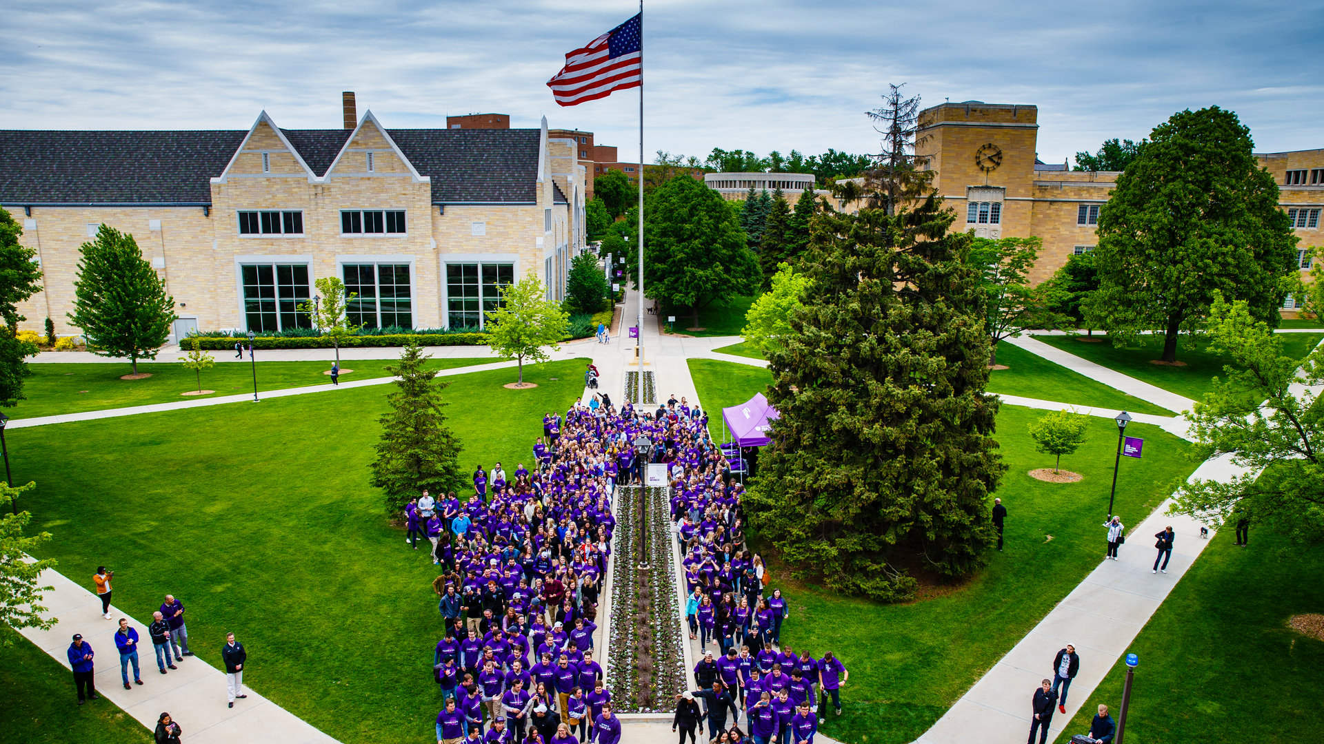 Aerial view of the St. Paul campus with a large group of students