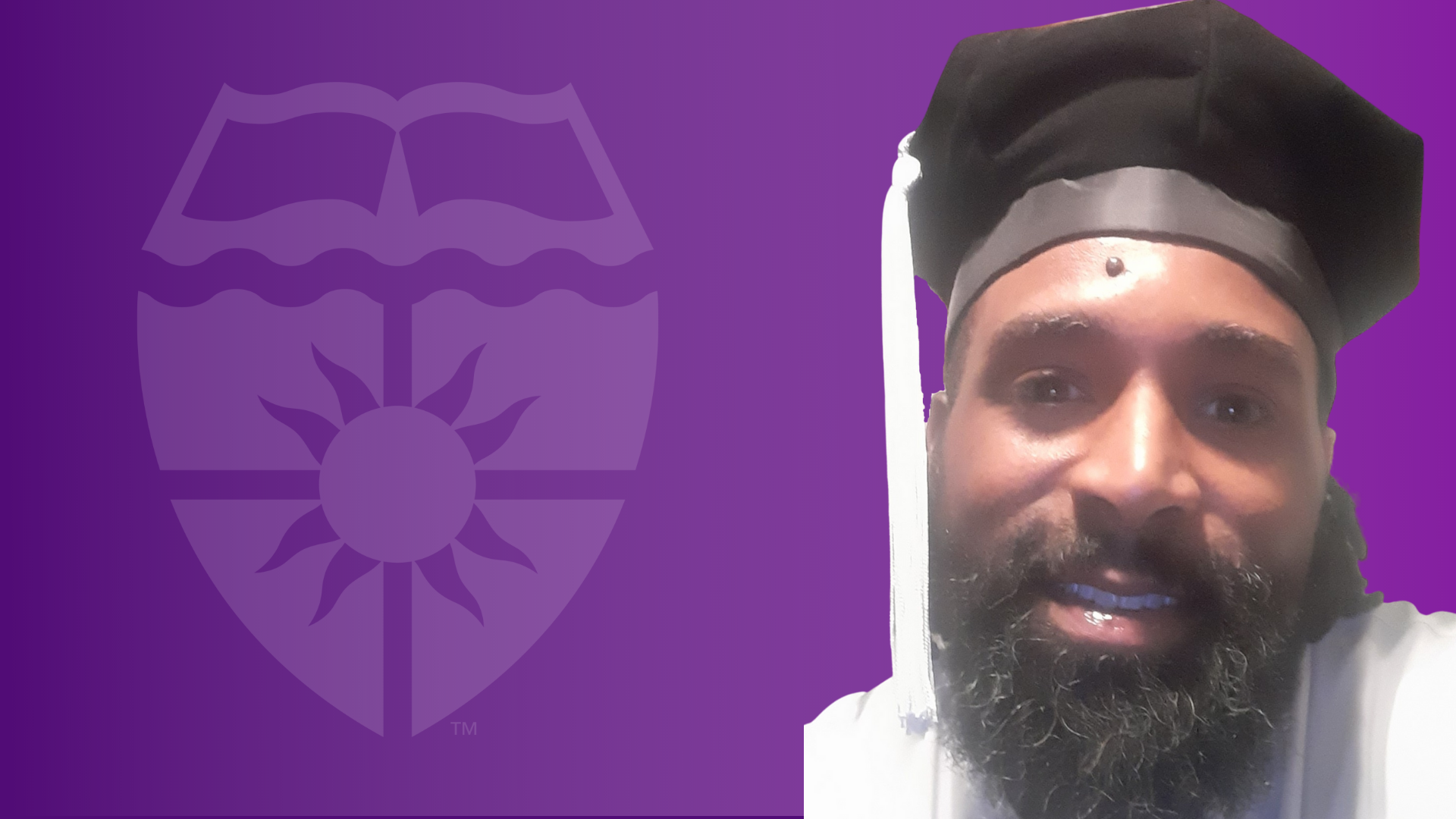 Kasim Abdur Razzaq in front of a purple background with the St. Thomas shield