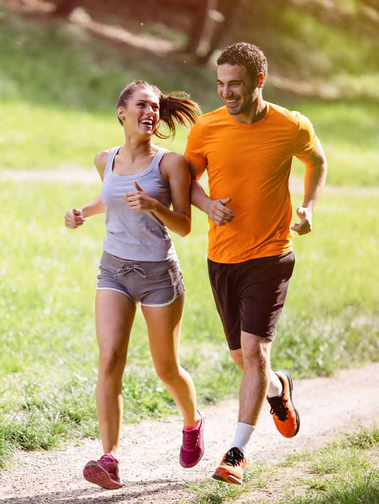 Two people jogging outside