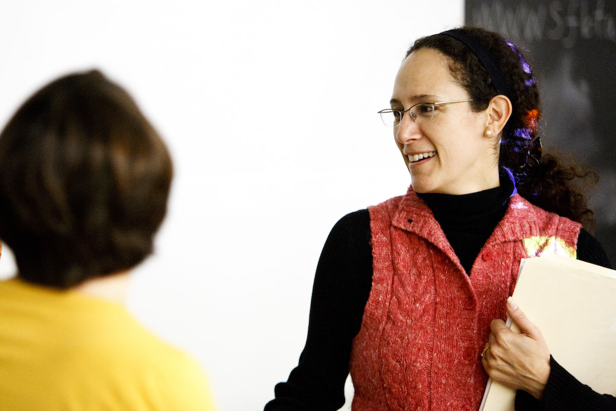 Professor Catherine Marrs Fuchsel talks with a student