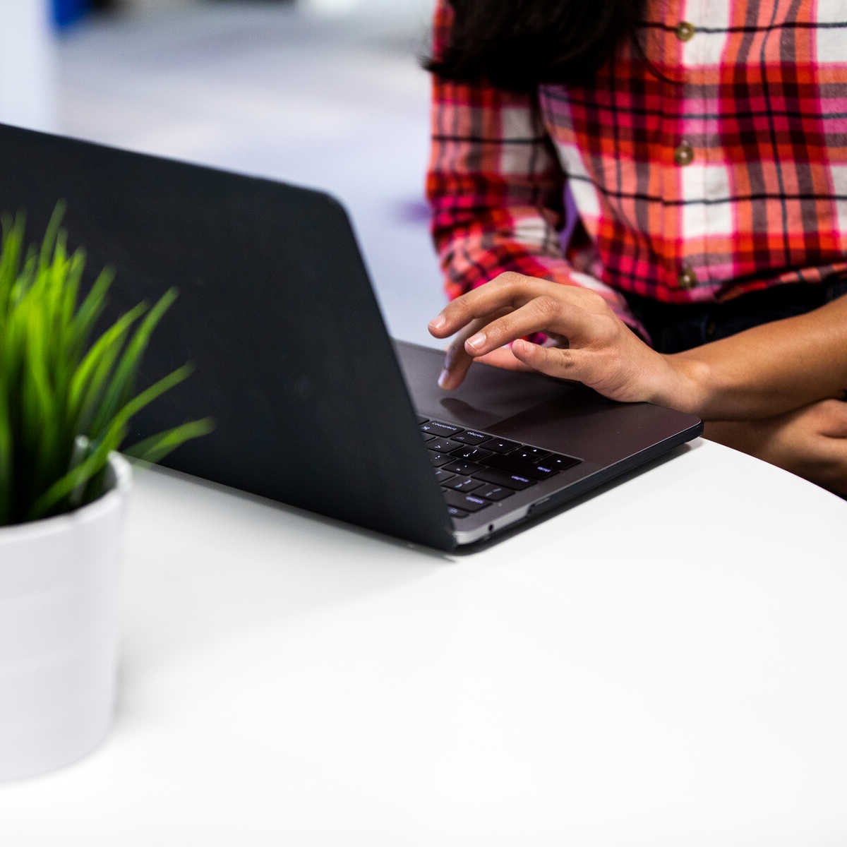 A woman using a laptop computer.
