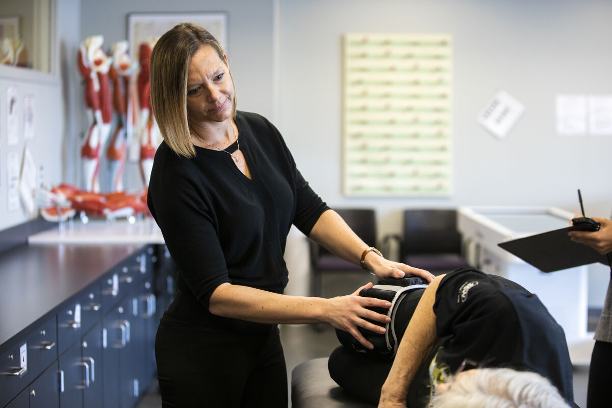 Woman working with elderly client