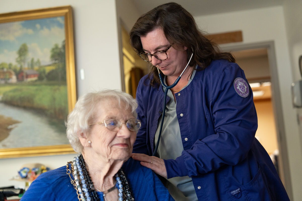Nursing student with patient