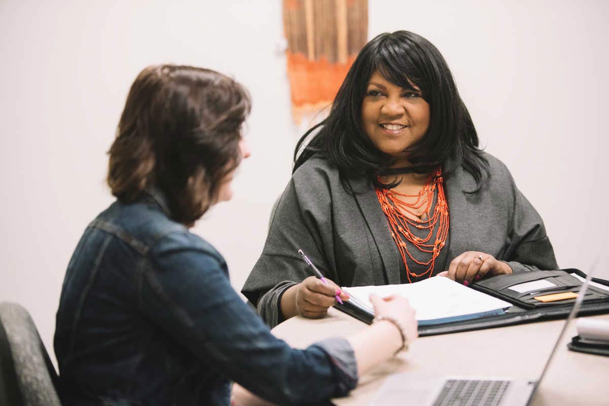 social worker talking to a client