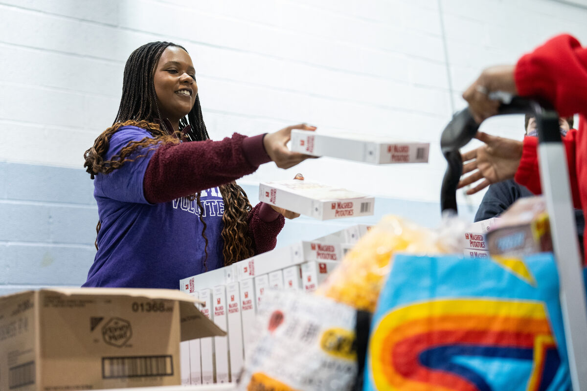 Student volunteering at food shelf