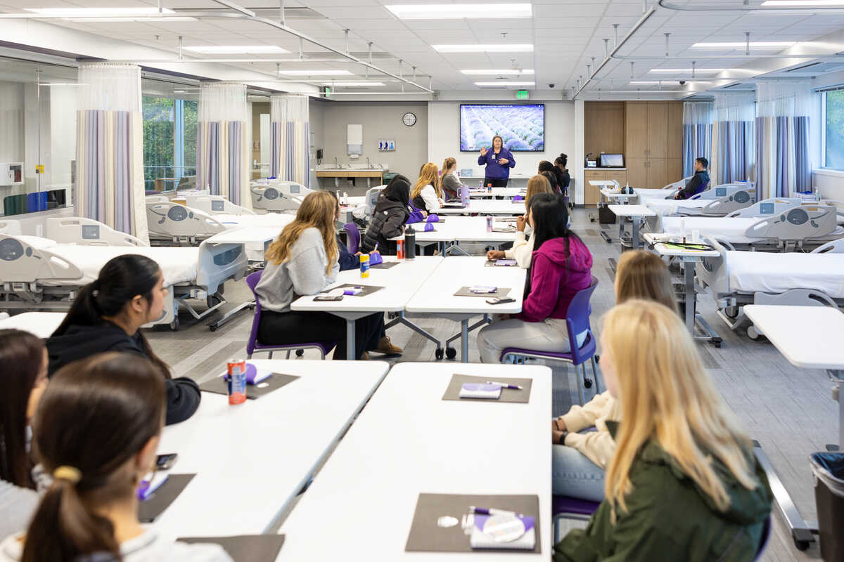 Students sitting at tables in the skills lab at St. Thomas