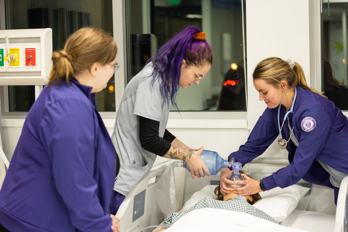 Professor supervising nursing students