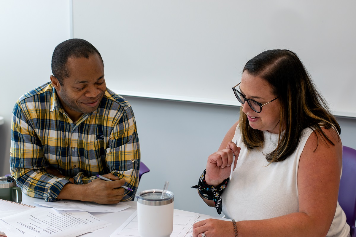 DSW student and Dr. Kingsley Chigbu in conversation.