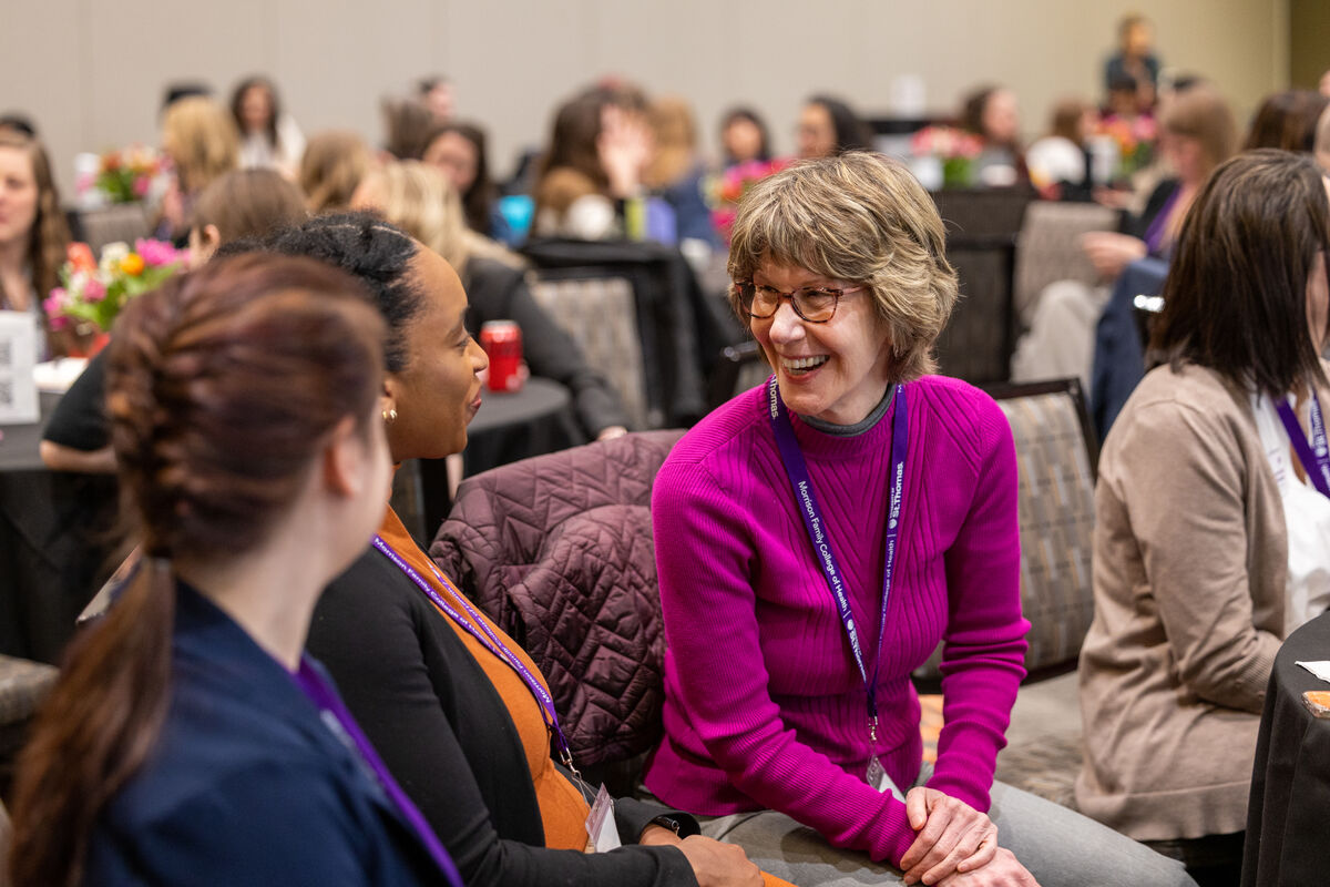Women chatting at an event