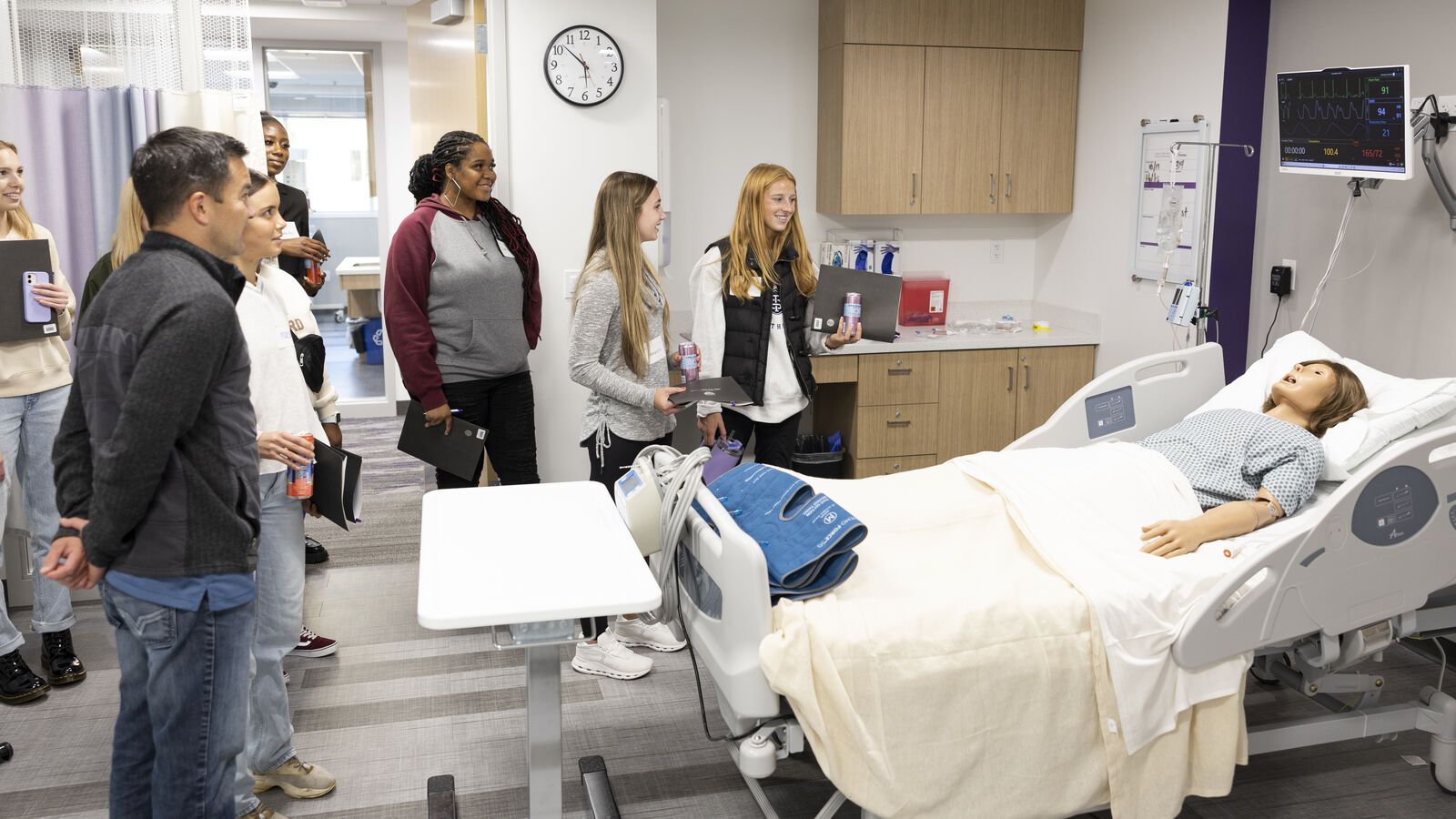 Students looking at nursing technology