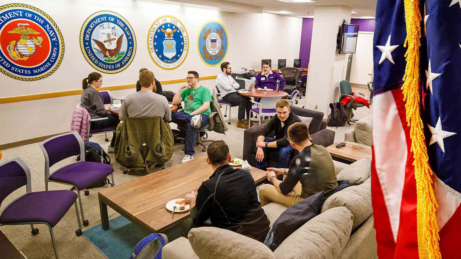Individuals sitting in a room.