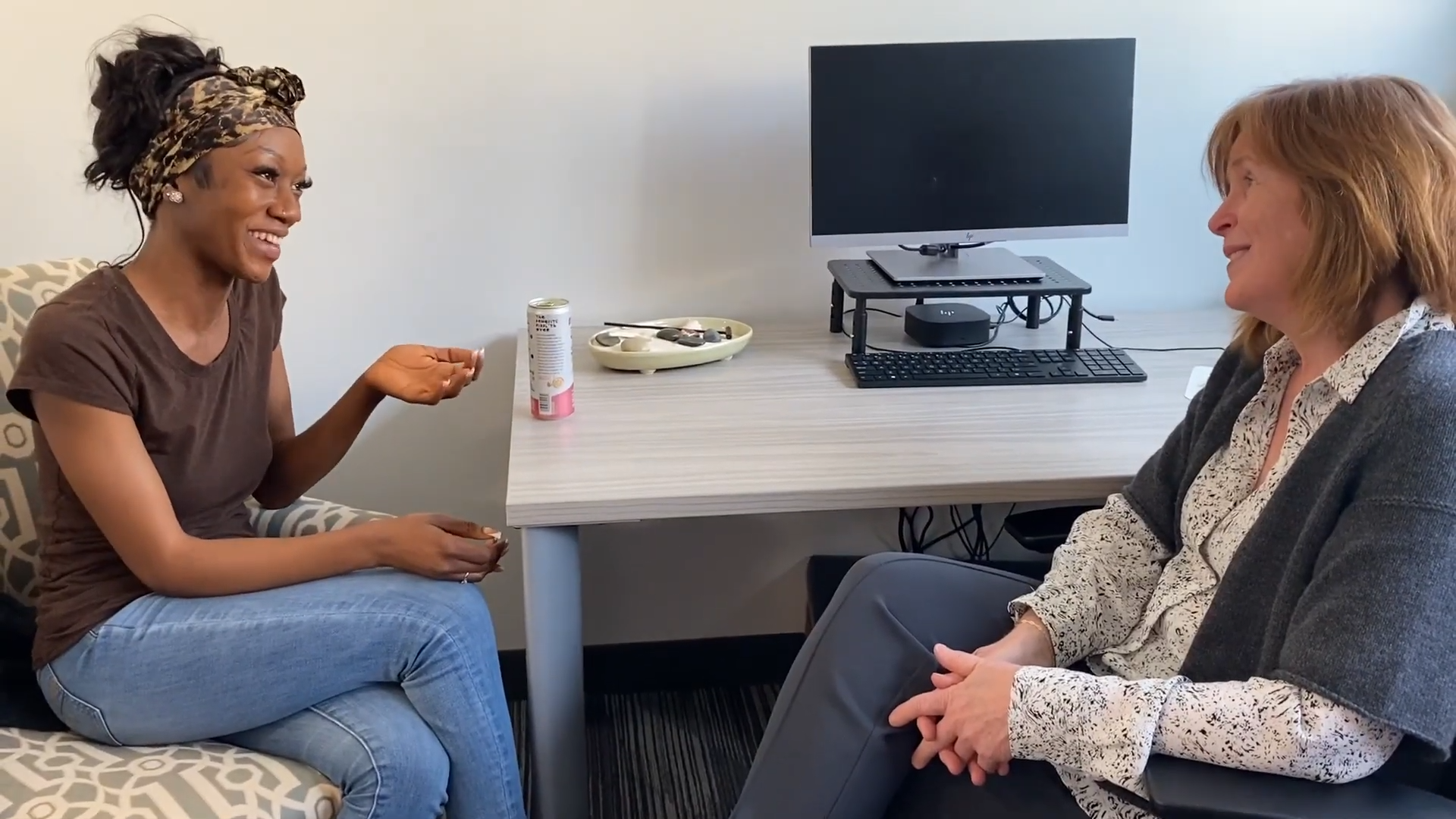 Edwina Vah talking with a professor in her office