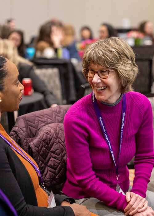 Conference attendees talking together