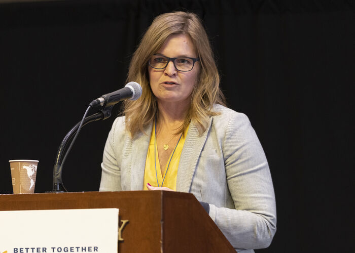 Melanie Ferris speaking at podium