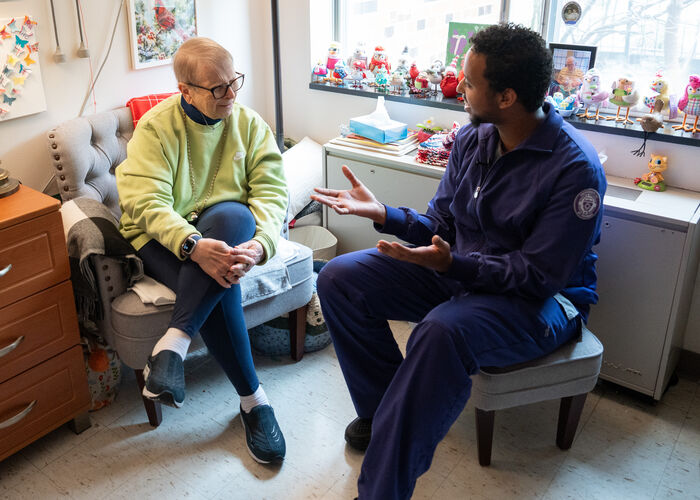Nursing student speaking to a patient