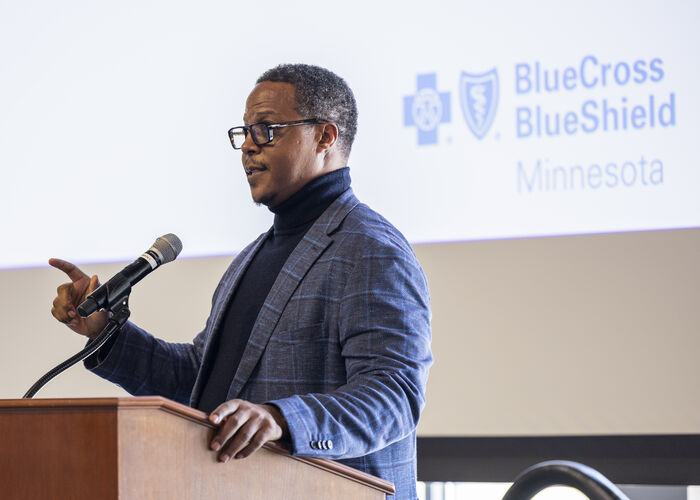 Bukata Hayes speaking at podium