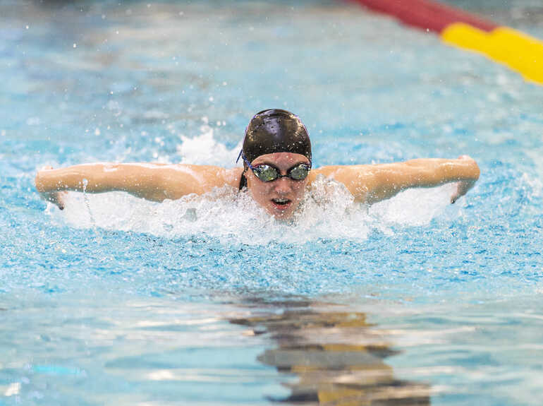 A person swimming in a pool