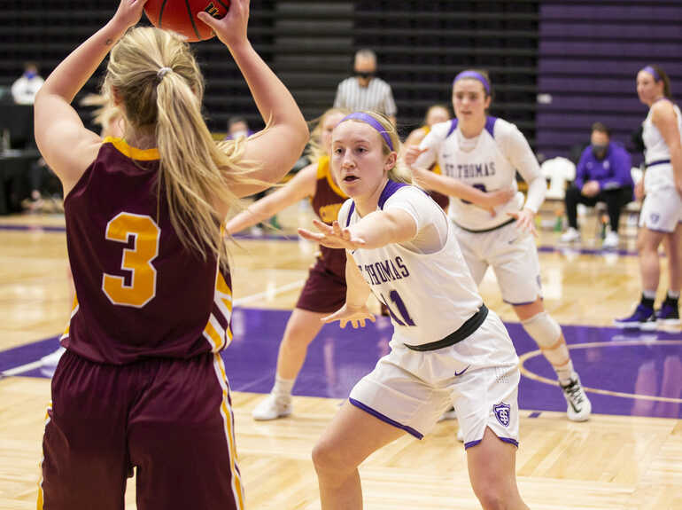 A woman plays basketball